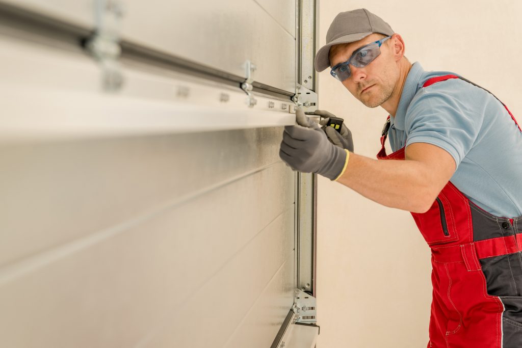 garage door technician repairing garage door